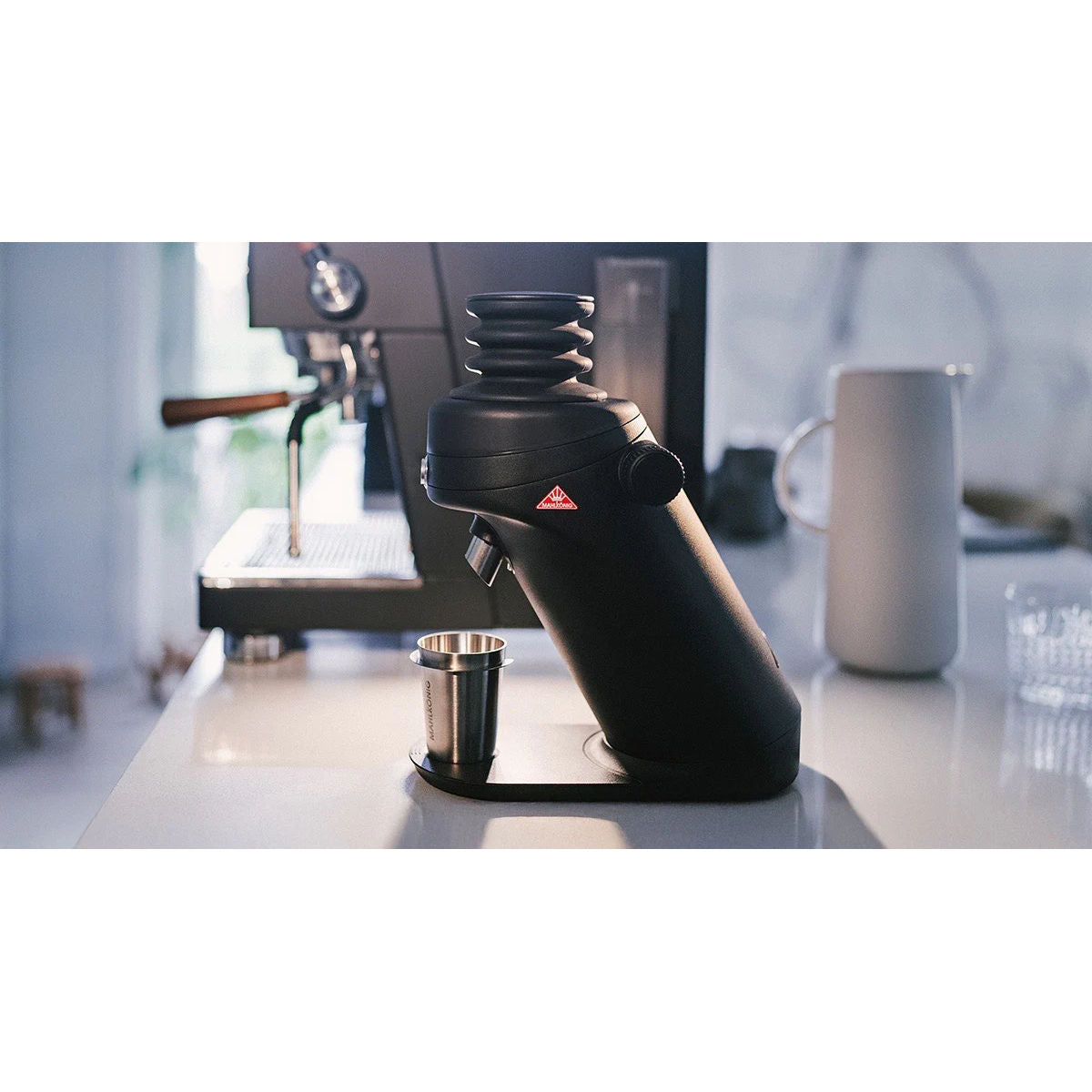 Mahlkönig X64 SD espresso grinder on an espresso bar at home