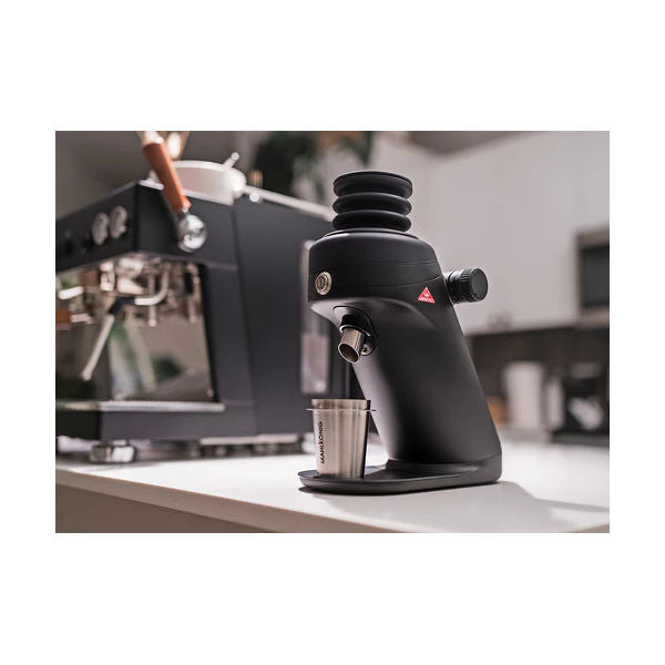Mahlkönig X64 SD espresso grinder on a commercial coffee bar