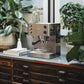Lelit Elizabeth V3 PID domestic espresso machine on a wooden counter with plants