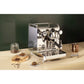 Rocket Fast Mozzafiato R Espresso Machine on a bar counter with coffee beans & cups